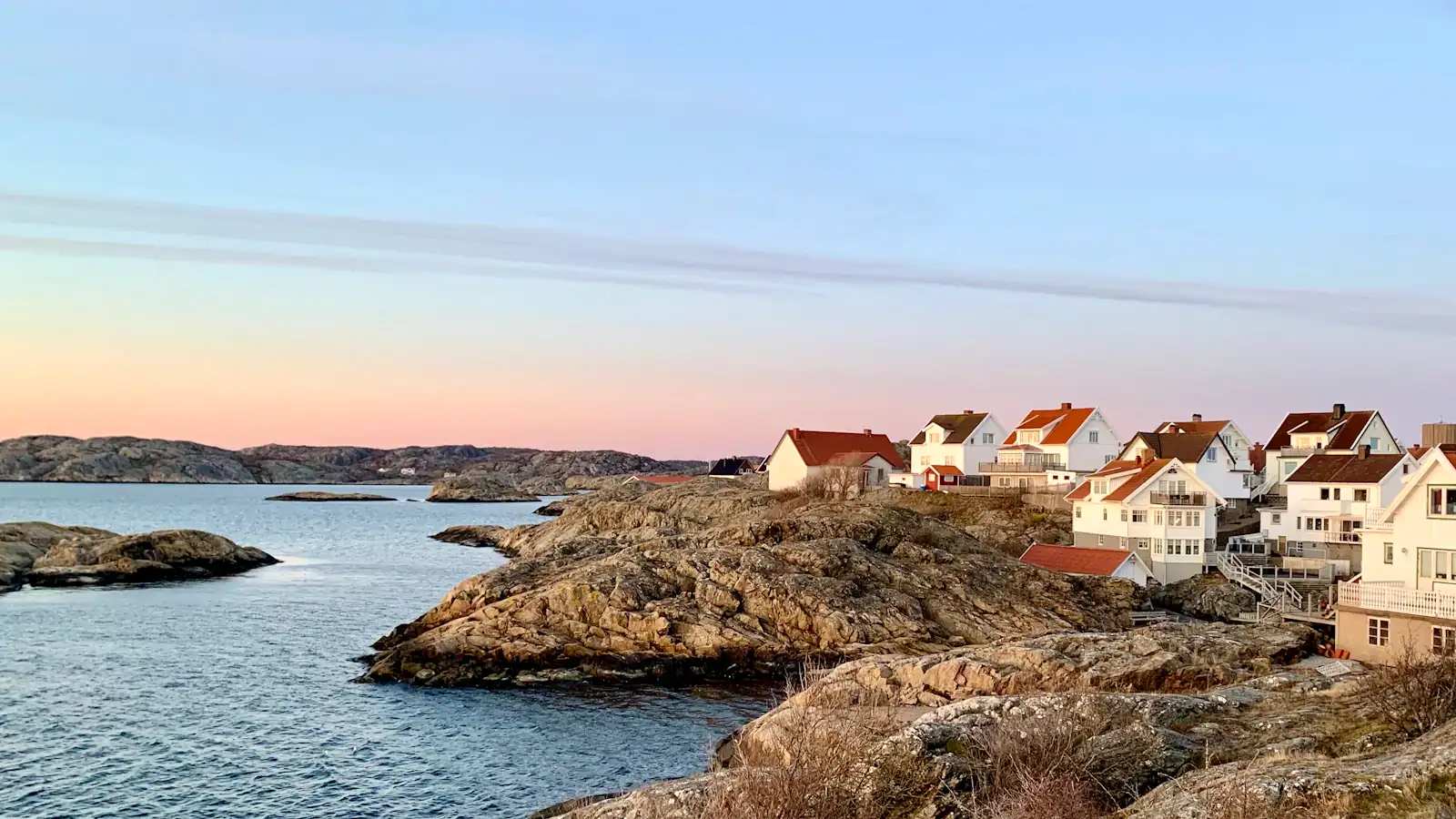 houses near body of water during daytime
